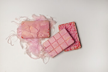 Pink chocolate bar with pashmania (cotton candy). Concept of indulgent sweets and exotic Turkish...