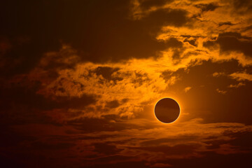 eclipse on the gold sunset sky and transparent cloud