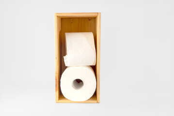 salvaged wooden box made into a toilet roll holder