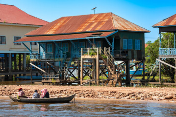 Floating village in Cambodia with traditional wooden houses