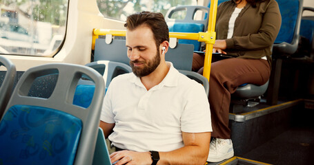 Bus, travel and businessman with earphones on laptop for journey, morning commute and trip in city. Public transport, passenger and person on computer listening to podcast, audio and radio in town