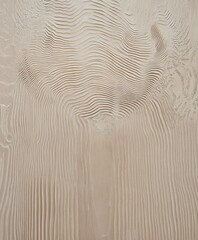 Gentle waves of sand create captivating shapes at a coastal area. Midday sun casts shadows, enhancing the textures of the sand dunes, showcasing nature's artistry