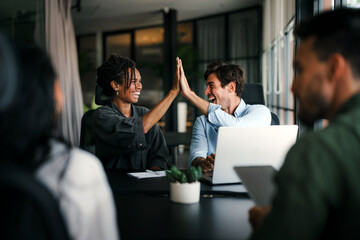 Success group of multiethnic entrepreneurs and business people achieving goals in corporate office