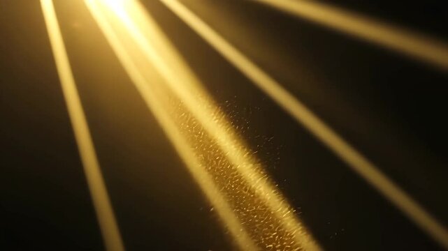 Golden Light Beams Casting Down with Dust Particles Against Dark Background