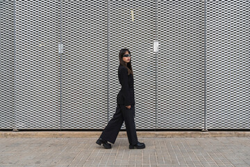 Asian businessoman wearing cyberglasses in a futuristic suit