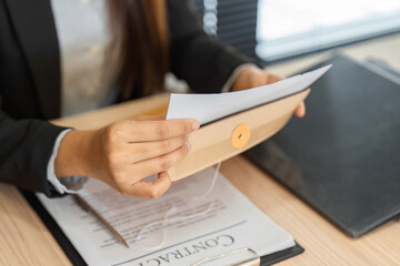 Legal Workflow and Document Handling. A professional organizing contract paperwork efficiently.