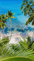 This aerial shot captures Koh Kood Islands vibrant turquoise waters, pristine beaches, and palm...