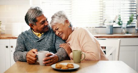 Hug, laughing and senior couple with coffee, kitchen and bonding with beverage in home or elderly people. Happy, old man and mature woman with tea in house, comfortable and funny joke in morning