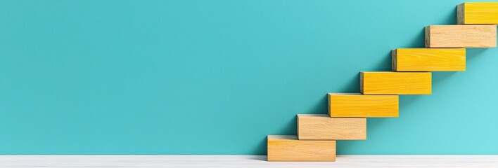 Fototapeta premium Wooden Blocks Form Upward Steps Against a Teal Background Representing Growth Concept and Achievement Ladder To Success