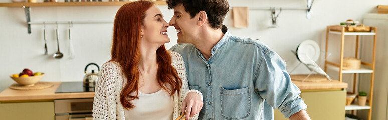 Young couple sharing a joyful moment at home while cooking together in the kitchen