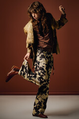 Stylish young man showcases creative fashion statement in a bold photoshoot setting