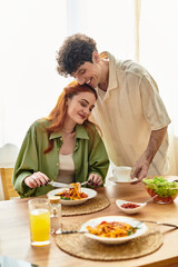 Young couple enjoying a cozy meal together at home filled with love and warmth