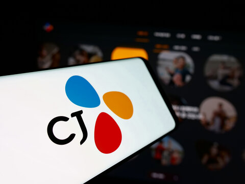 Stuttgart, Germany - 03-06-2025: Smartphone with logo of South Korean company CJ Corporation on screen in front of business website. Focus on center-left of phone display.