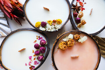 Handmade eco-friendly coconut shell candle with natural soy wax, a wooden wick, and a tropical aroma, perfect for a cozy, sustainable, and relaxing ambiance