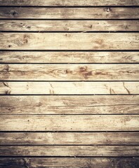 A close-up view of weathered wooden planks showcases the natural texture and patterns, making it an ideal choice for rustic decor and creative projects