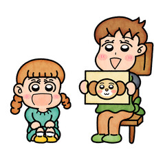 園児に紙芝居を見せている保育士