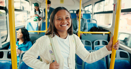 Portrait, bus and girl with smile, travelling and safety with public transportation. Face, people and child with morning commute, urban journey and excited with bag, teenager or passenger in New York © peopleimages.com