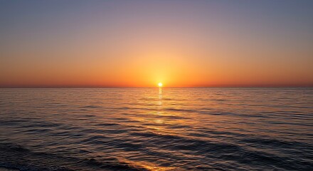 Naklejka premium Serene Ocean Sunset Golden Hour Seascape with Calm Waters and Vibrant Sky