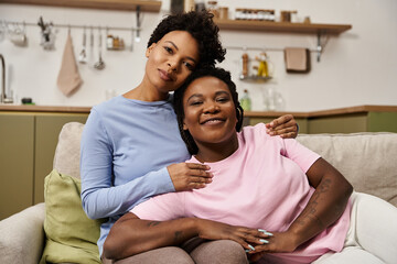 Loving family enjoying cozy moments on a comfortable couch in their home
