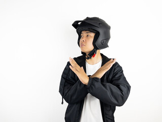 asian man wearing motorcycle helmet with open hand doing stop sign with serious and confident expression, defense gesture isolated on white background