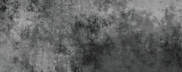 Fototapeta premium The Timeworn and Scratched Surface of a Darkened Concrete Wall with Industrial Appeal