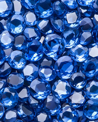 Close-up of numerous vibrant,faceted, sapphire-blue gemstones