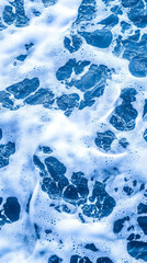 Close-up of ocean waves and foam, textured surface
