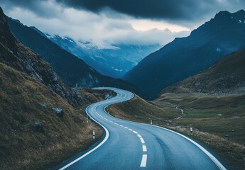 Fototapeta premium Winding mountain road through dramatic landscape