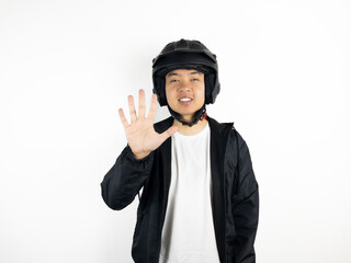 Asian man wearing motorcycle helmet isolated on white background. showing and pointing up with fingers number one to ten while smiling confidently and happily.1,2,3,4,5,6,7,8,9,10
