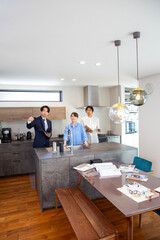 Housing sales: Japanese person explaining kitchen in model house