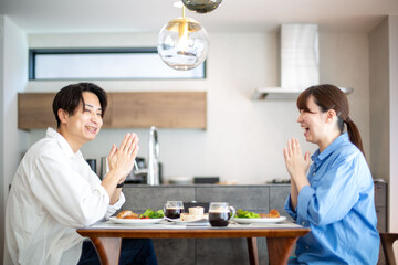 A young Japanese couple enjoying a holiday lunch