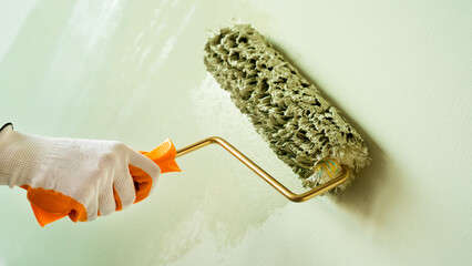 Hand painting wall in green color