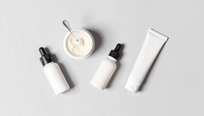 Skincare products arranged on a minimalist background  