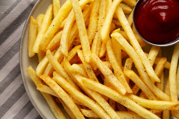 Homemade French Fries and Ketchup on a Plate, top view.