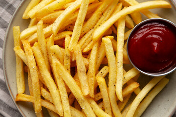 Homemade French Fries and Ketchup on a Plate, top view.