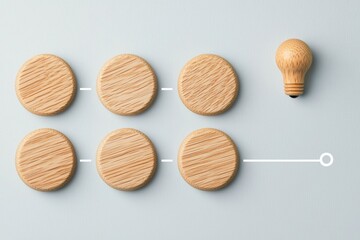 Wooden Discs Leading to Lightbulb Representing Idea Generation On Blue Surface, Creative Concept, Studio Shot in Soft Lighting