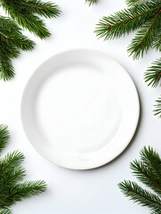 Empty plate surrounded by fir branches on white