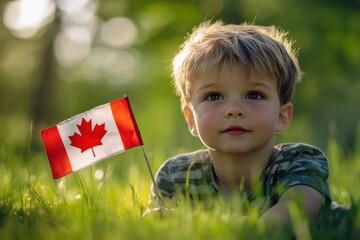 Child lies in grassy field with Canadian Flag celebrating national pride
