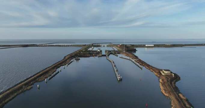 Lorentz locks, water way, transportation infrastructure at the Afsluitdijk, Kornwerderzand, Friesland, The Netherlands. Aerial drone view.