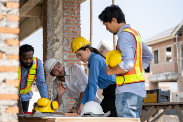 Construction engineers supervising progress of construction project. engineering or worker in...