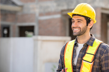 A construction worker at construction site.  engineering or worker in safety vest observing a building A team of construction engineers. workers at the construction site. 