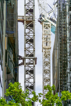 Crane scaffolding between two buildings under construction