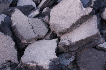 Damaged asphalt. Replacement of asphalt in the process of road repair work