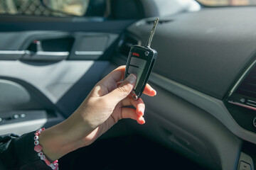 Caucasian woman showing car key.