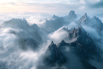 Breathtaking Aerial View of a Mountain Range Shrouded in Clouds.
