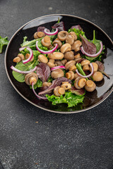 Champignon salad green lettuce canned mushrooms fresh delicious gourmet food background on the table rustic food top view copy space keto and paleo diet vegetarian and vegan food