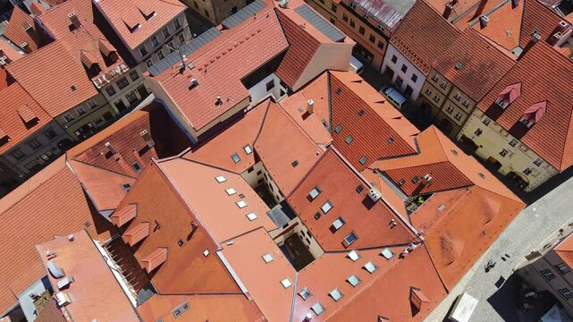 Red tile rooftops form geometric patterns, historic Prachatice Old Town, Czechia