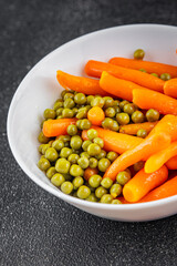 Green peas and carrot canned food tasty fresh delicious gourmet food background table rustic food top view copy space keto and paleo diet vegetarian and vegan food