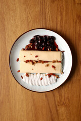 Sweet flapjacks with cottage cheese, butter cream and cherry jam