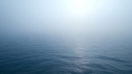 Obraz premium A vast expanse of tranquil ocean under a hazy sky